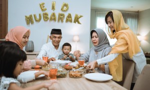 muslim asian family and grandparents having break fasting on ramadan