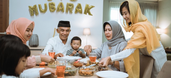 muslim asian family and grandparents having break fasting on ramadan